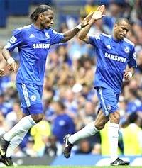 Didier Drogba celebrates with teammates Jose Bosingwa