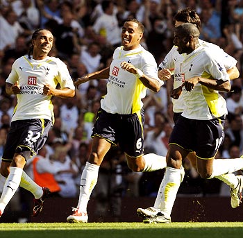 Tottenham Hotspur's Benoit Assou-Ekotto (left) celebrates with team-mates after scoring