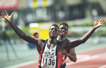 Carl Lewis reacts to winning the 100m with a world record time of 9.86 at the World championships in Tokyo on August 25, 1990