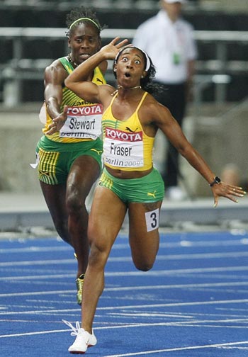 Shelly-Ann Fraser of Jamaica celebrates after winning ahead of her compatriot Kerron Stewart in the women's 100 metres final