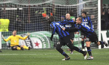 Inter Milan's Ballotelli (second from right) celebrates with Wesley Sneijder after scoring past Rubin Kazan goal-keeper Ryzhikov (in the backgound)