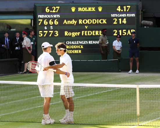 Federer is congratulated by Roddick