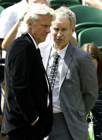 Former tennis champions Bjorn Borg (left) and John McEnroe chat on Centre Court before the final