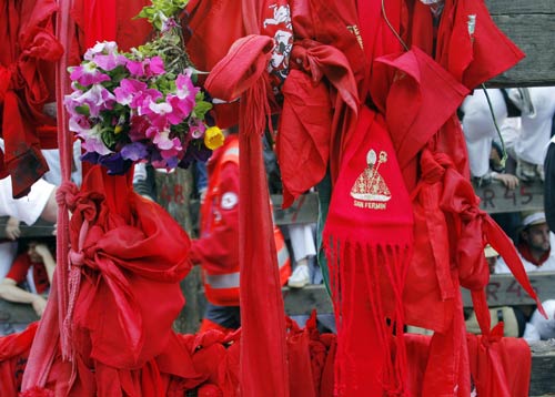 Traditional San Fermin handkerchiefs and scarves are left at the site where Daniel Jimeno was gored to death