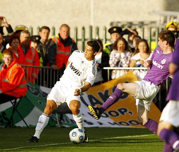 Cristiano Ronaldo clashes with Shamrock Rovers' Pat Flynn