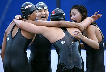 Yang Yu, Zhu Qian Wei, Liu Jing and Pang Jiaying celebrate winning the 4x200m freestyle relay gold