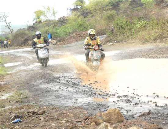 Riders exercise caution while negotiating the slush