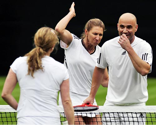 Graf reacts after Agassi accidentally hit a ball straight at Clijsters