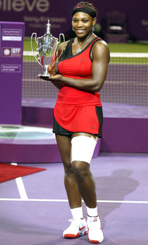 Serena Williams with her trophy after winning the Doha tennis championship on Sunday