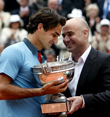 Andre Agassi (right) with Roger Federer