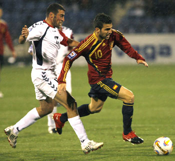 Spain's Cesc Fabregas steals the ball from Armenia's Yavruyan during their World Cup qualifier in Yerevan on Saturday