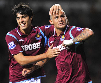 West Ham's Alessando Diamanti celebrates with James Tomkins after scoring during their English Premier League soccer match against Arsenal at Upton Park in London on Sunday