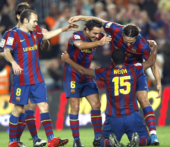 Barcelona's Seydou Keita celebrates with team-mates after scoring against Zaragoza during their La Liga match at Camp Nou in Barcelona on Sunday