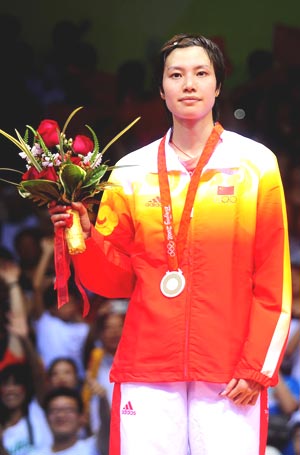 Xie with her Olympics silver medal