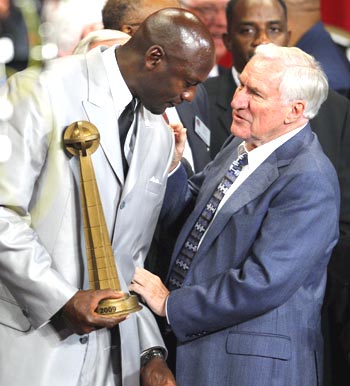 Michael Jordan talks to coach Smith during the induction ceremony on Friday