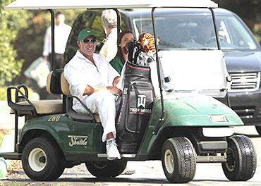 Steve Williams, caddie of Tiger Woods, watches as Woods playes a practice round in Augusta