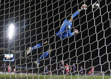 Lyon goalkeeper Hugo makes a save