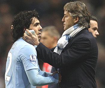 carlos tevez (left) with roberto mancini