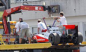 Lewis Hamilton's car is removed from the race track on Sunday