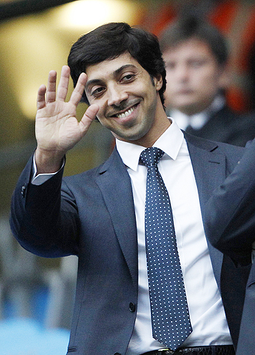 Manchester City's owner Sheik Mansour bin Zayed Al Nahyan acknowledges the crowd ahead of their EPL match against Liverpool on Monday