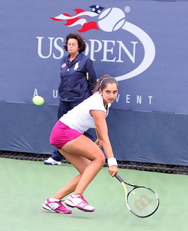 Sania Mirza in action against Ksenia Lykina of Russia