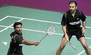 India Sanave Thomas and Rupesh Kumar (right) in action against South Africa's Willem Viljoen and Dorian Lance James in their men's doubles match at the badminton World championships in Paris
