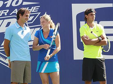 Roger Federer of Switzerland, Kim Clijsters of Belgium and Rafael Nadal from Spain at the Arthur Ashe Kids Day at the US Open tennis tournament in New York, on Saturday