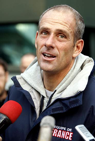 French Davis Cup team captain Guy Forget speaks to reporters after a team training session in Belgrade