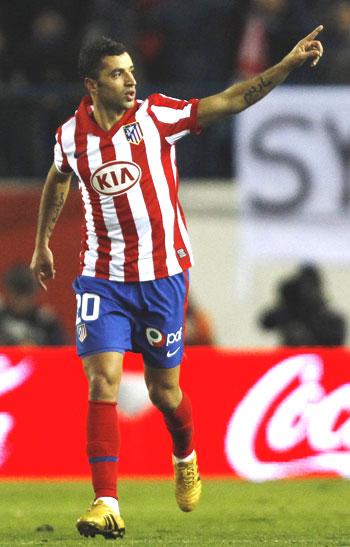 Atletico Madrid's Simao Sabrosa celebrates after scoring against Barcelona on Sunday