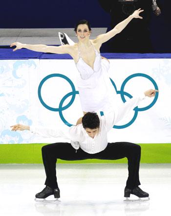 Canada's Tessa Virtue (top) and Scott Moir perform in the ice dance free dance figure skating event