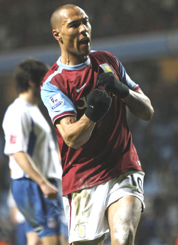 Aston Villa's John Carew celebrates after scoring against Crystal Palace during their FA Cup fifth round replay match at Villa Park on Wednesday