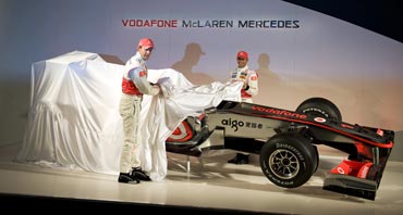 Jenson Button and Lewis Hamilton unveil the new McLaren Mercedes MP4-25 race car