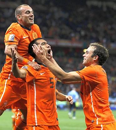 Van Bronckhorst celebrates after scoring