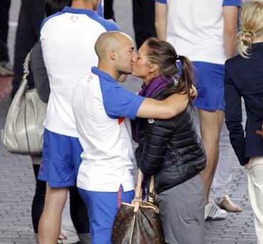 Netherlands' Demy de Zeeuw kisses his partner as they walk into the Sandton Hilton hotel in Johannesburg