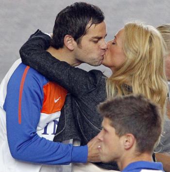 Netherlands' Sander Boschker kisses his partner as they walk into the Sandton Hilton hotel in Johannesburg