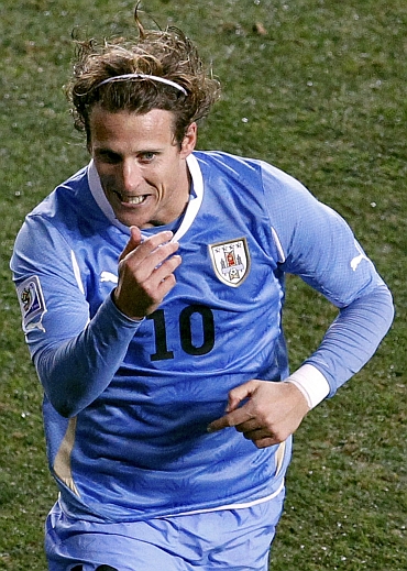 Diego Forlan celebrates after scoring a goal