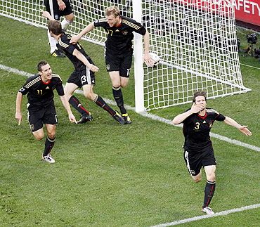 Arne Friedrich (right) celebrates after scoring against Argentina