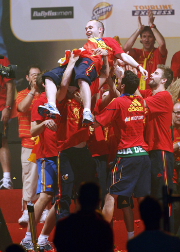 Spain's Iniesta is thrown into the air by his team-mates as they celebrate their World Cup victory