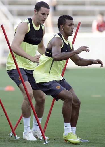 Manchester United players John O'Shea and Nani during a workout session in Bridgeview