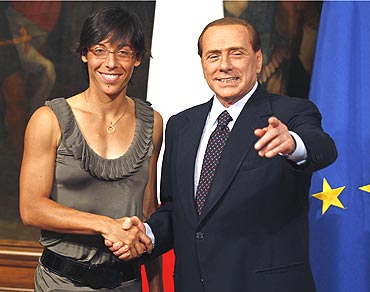 Italian Prime Minister Silvio Berlusconi (right) with French Open winner Francesca Schiavone at the Chigi palace in Rome