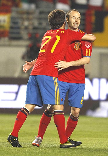 Spain's David Silva (left) celebrates with team-mate Andres Iniesta after scoring