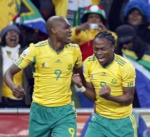 Tshabalala celebrates his goal against Mexico with team mate Mphela