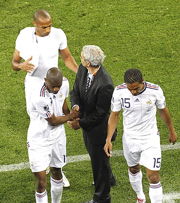 French coach Raymond Domenech greets his players after their match against Uruguay on Friday