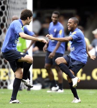 Robinho (right) dances with Kaka