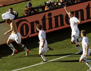 New Zealand's Winston Reid (left) takes off his jersey as he celebrates his goal with team mates