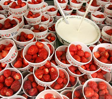 Strawberries and cream are offered for sale at Wimbledon