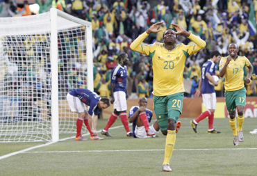 South Africa's Bongani Khumalo (C) celebrates his goal during the 2010 World Cup Group A soccer match against France at Free State stadium in Bloemfontein