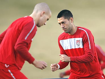US midfielders Clint Dempsey (right) and Michael Bradley go through the grind during a training session