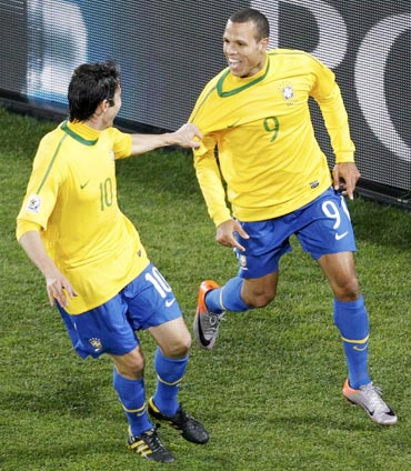Luis Fabiano (right) celebrates with Kaka after scoring against Chile