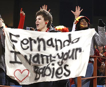 A fan of Spain's Fernando Torres holds up a banner